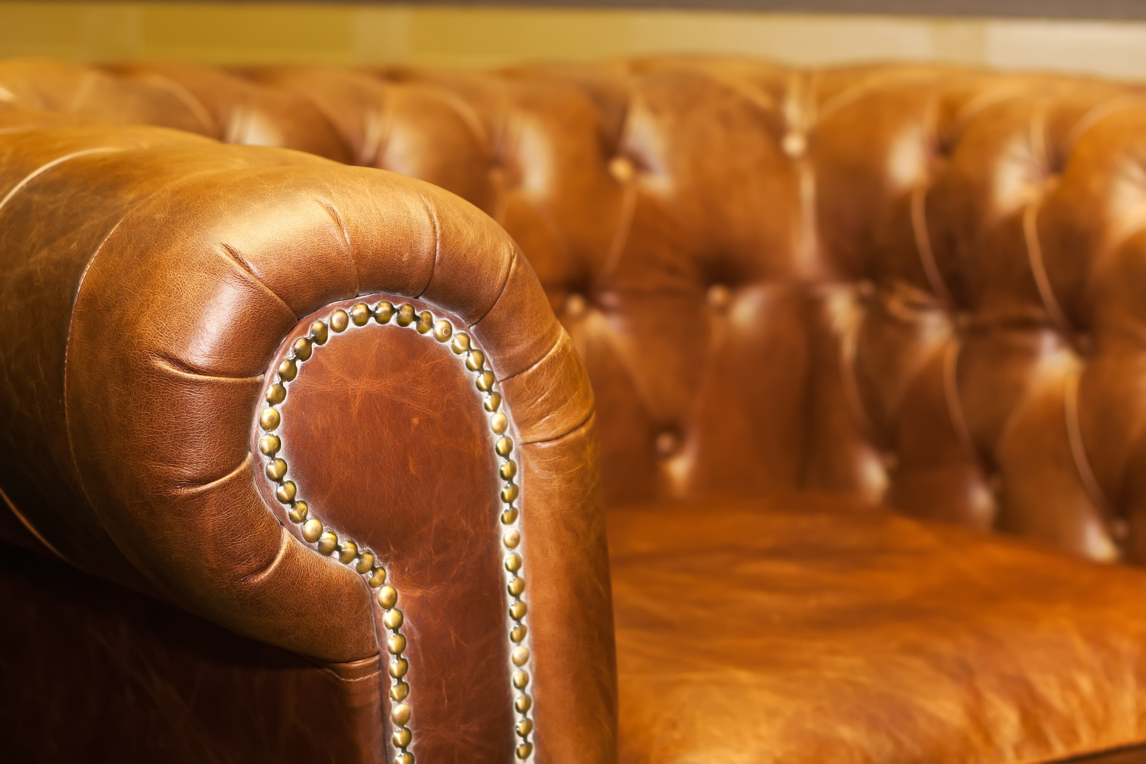 Close up of comfortable luxury leather sofa in the room